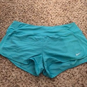 Teal Nike running shorts